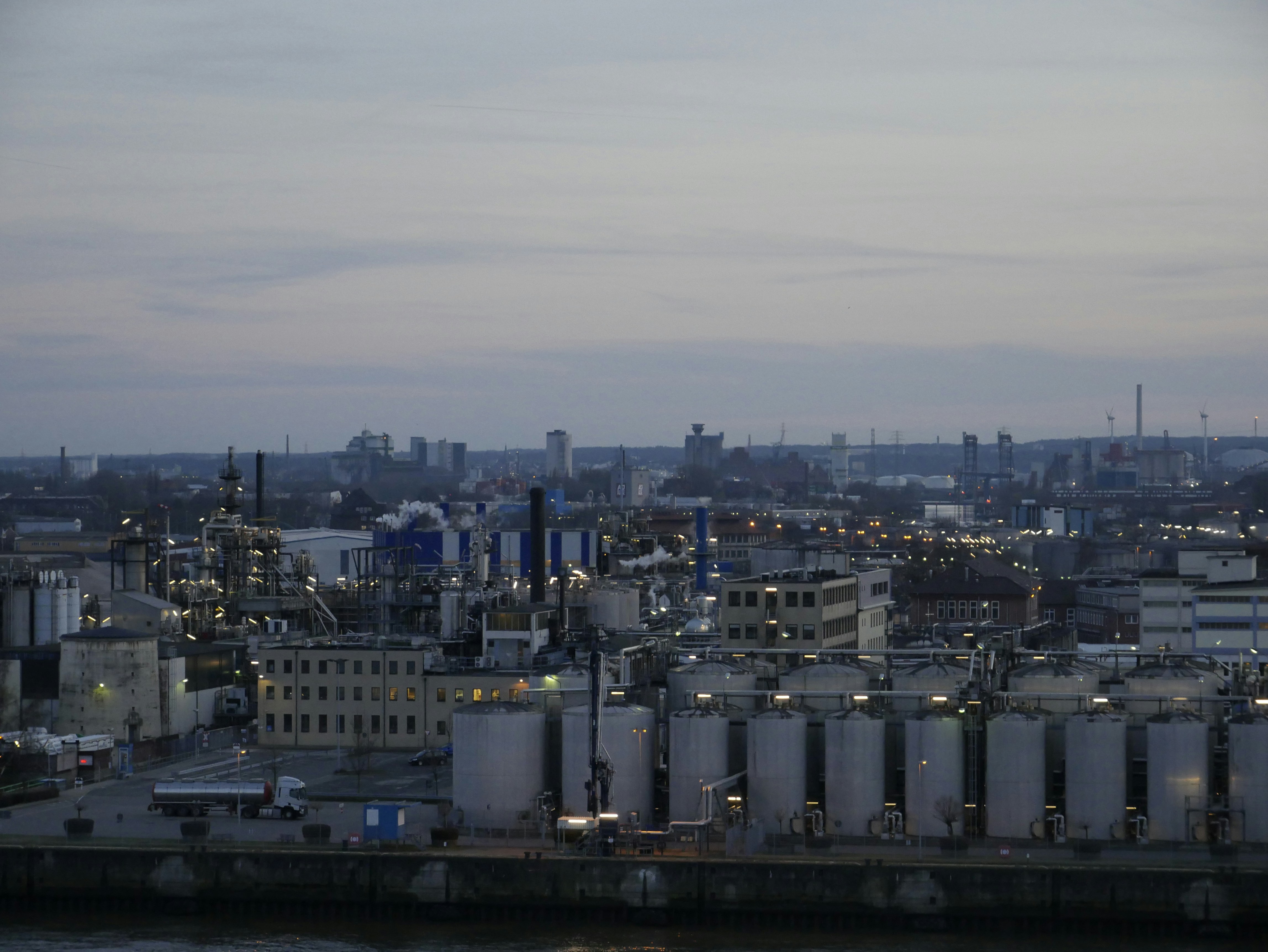 cityscape with smokestacks and industrial plant