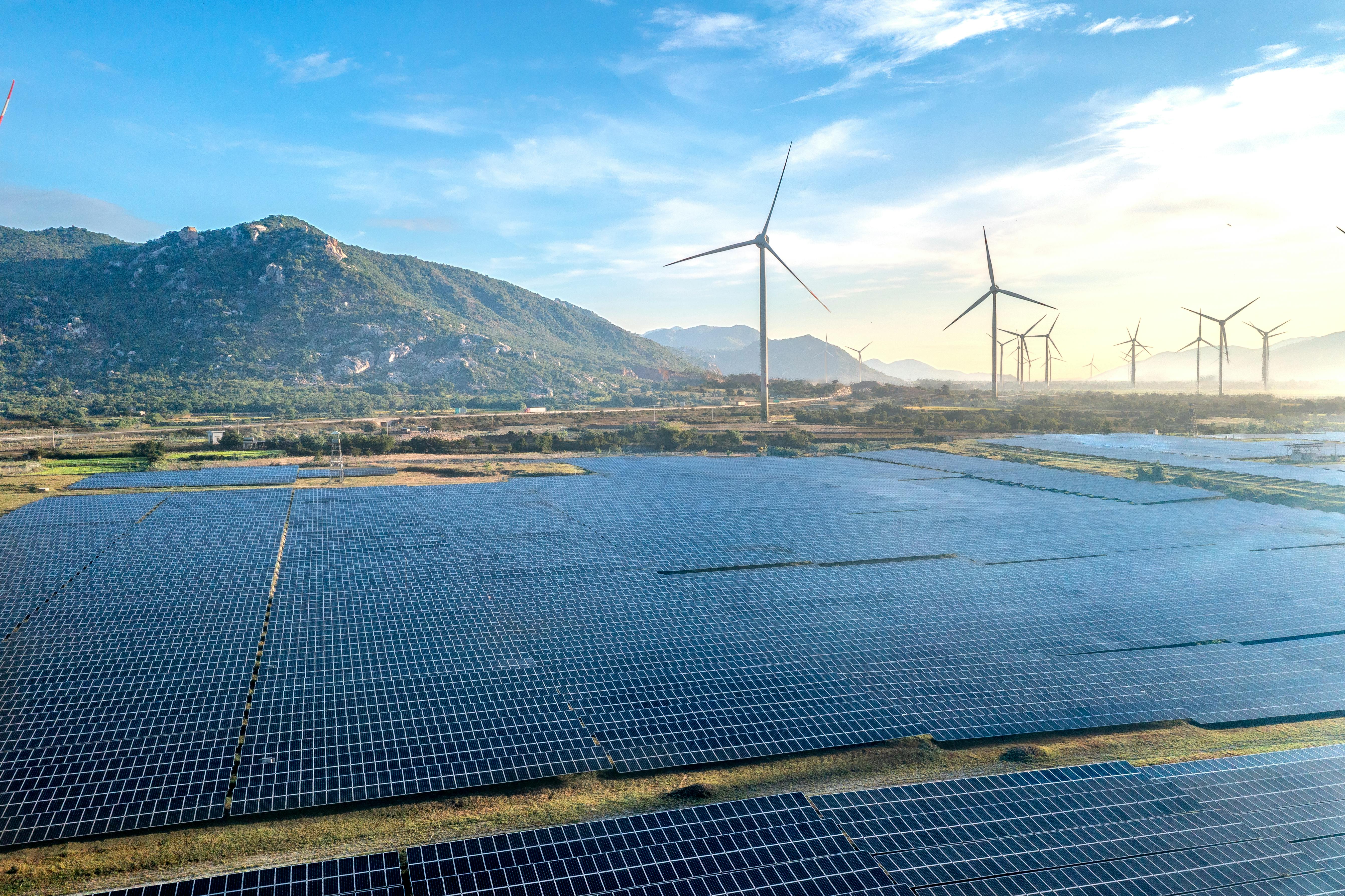 Mountains scape with wind farm and solar panels 