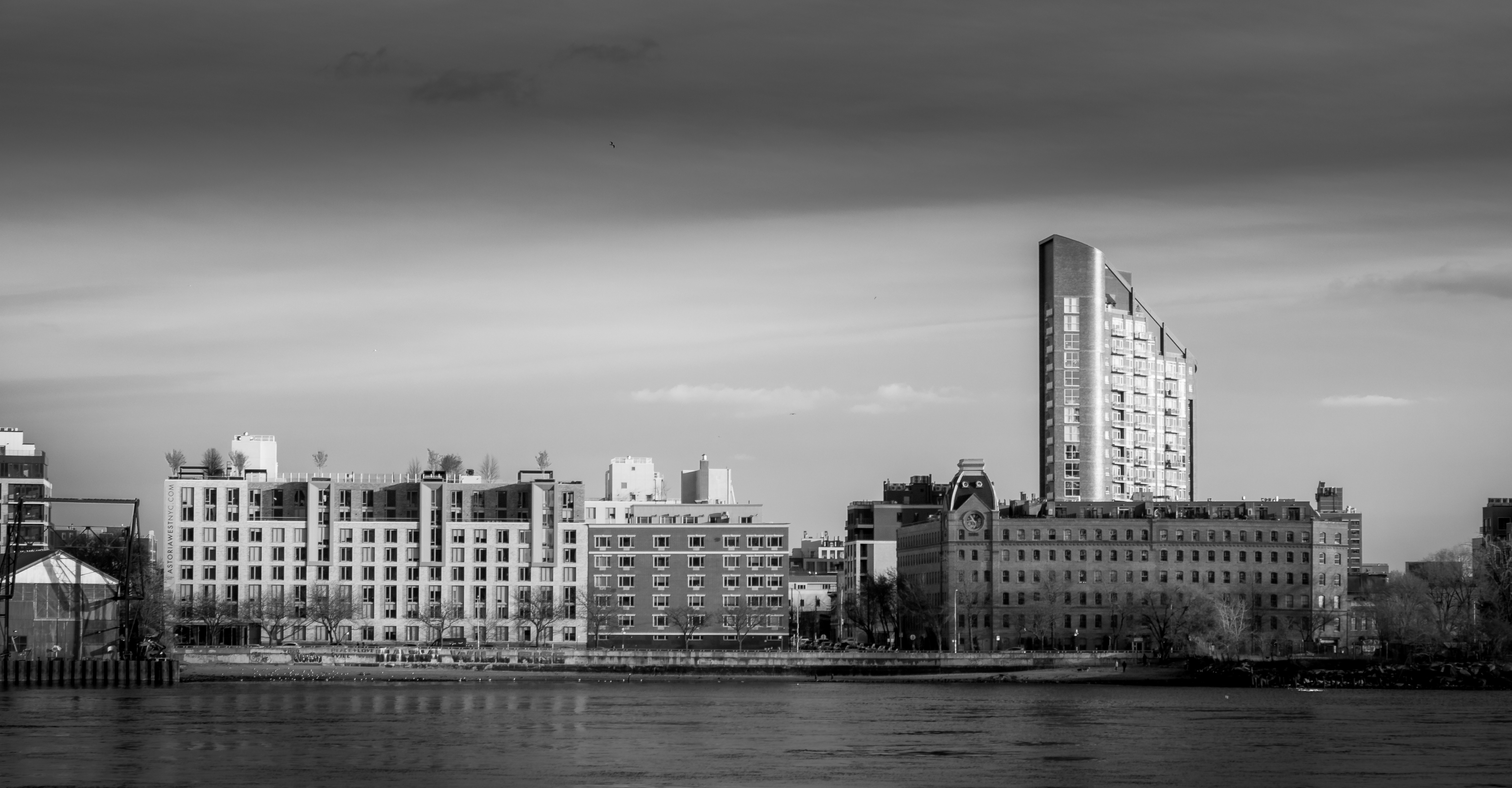 City skyline with modern buildings and river.